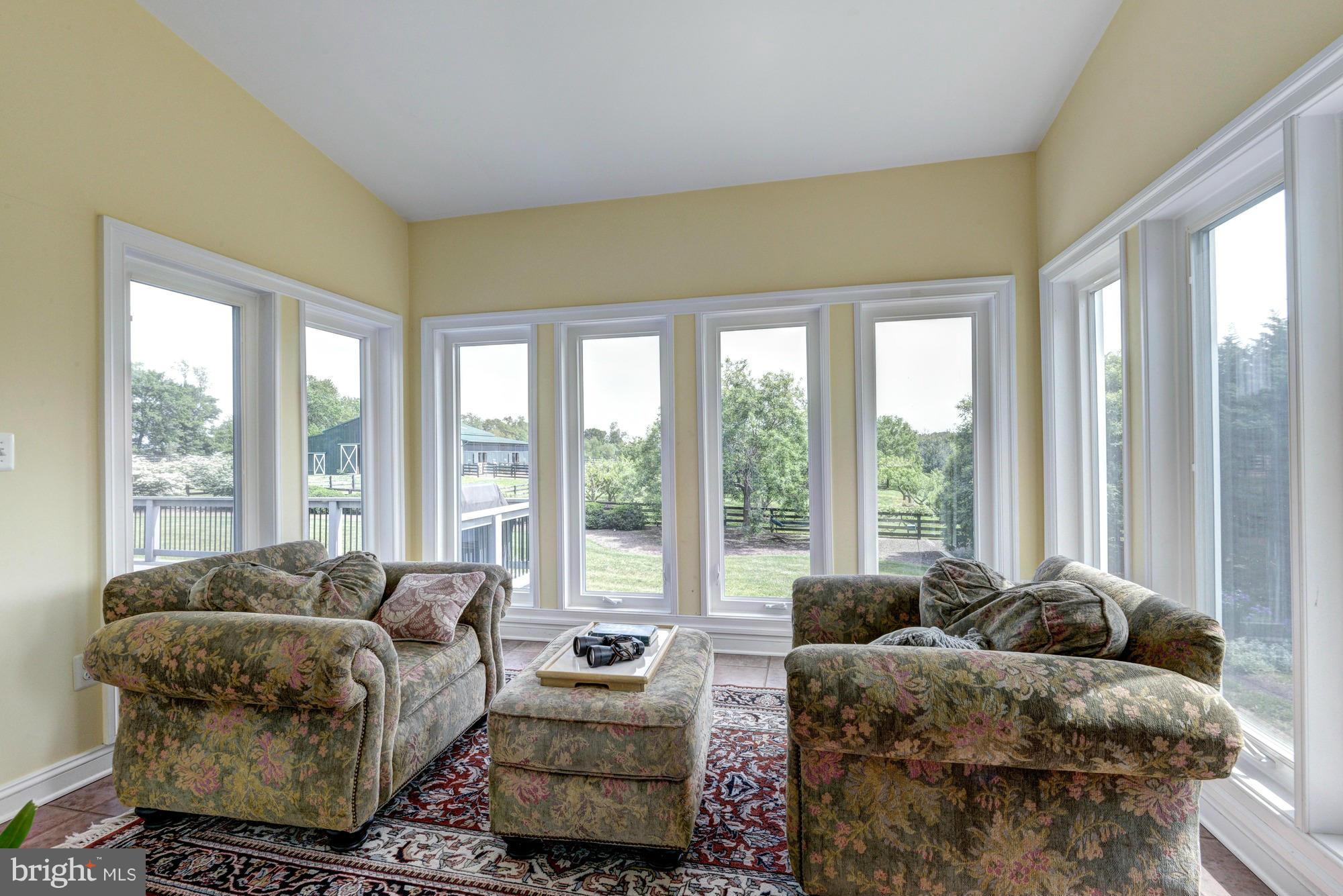20500 Westerly Road Poolesville, MD 20837 - Photo 16 of 30 a living room with furniture and a large window
