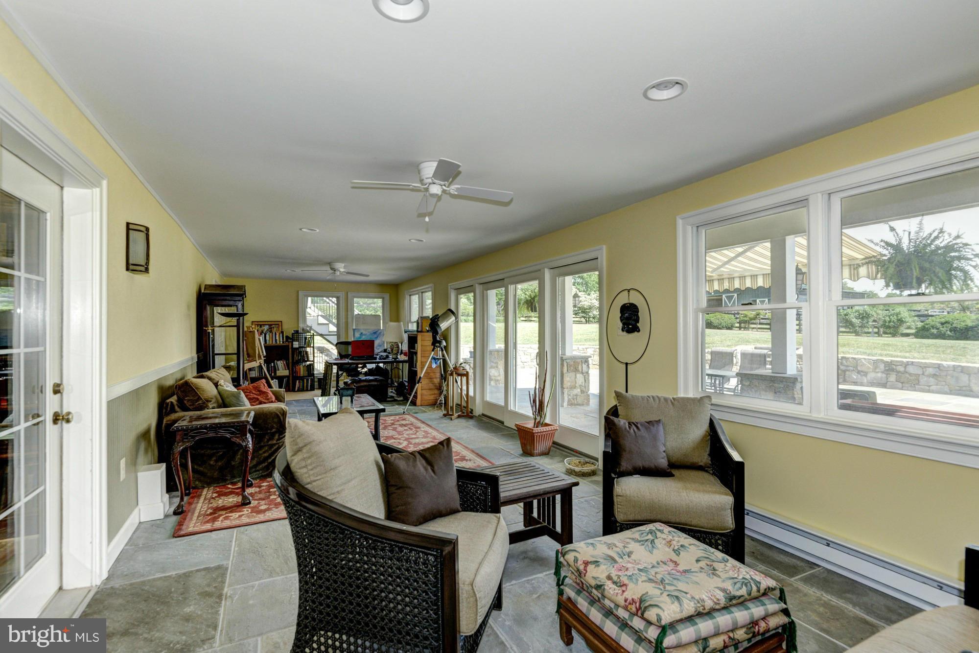 20500 Westerly Road Poolesville, MD 20837 - Photo 17 of 30 a living room with furniture and a large window