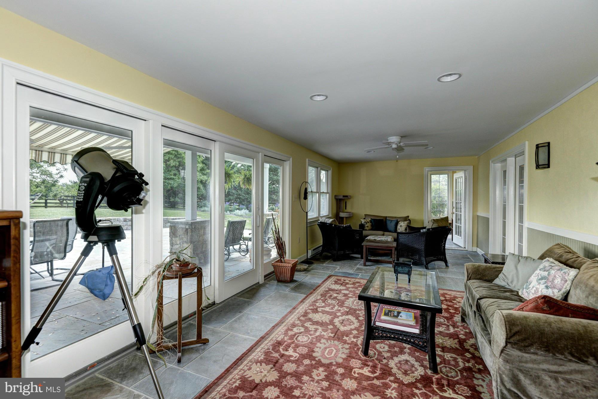 20500 Westerly Road Poolesville, MD 20837 - Photo 18 of 30 a living room with furniture a couch and large windows