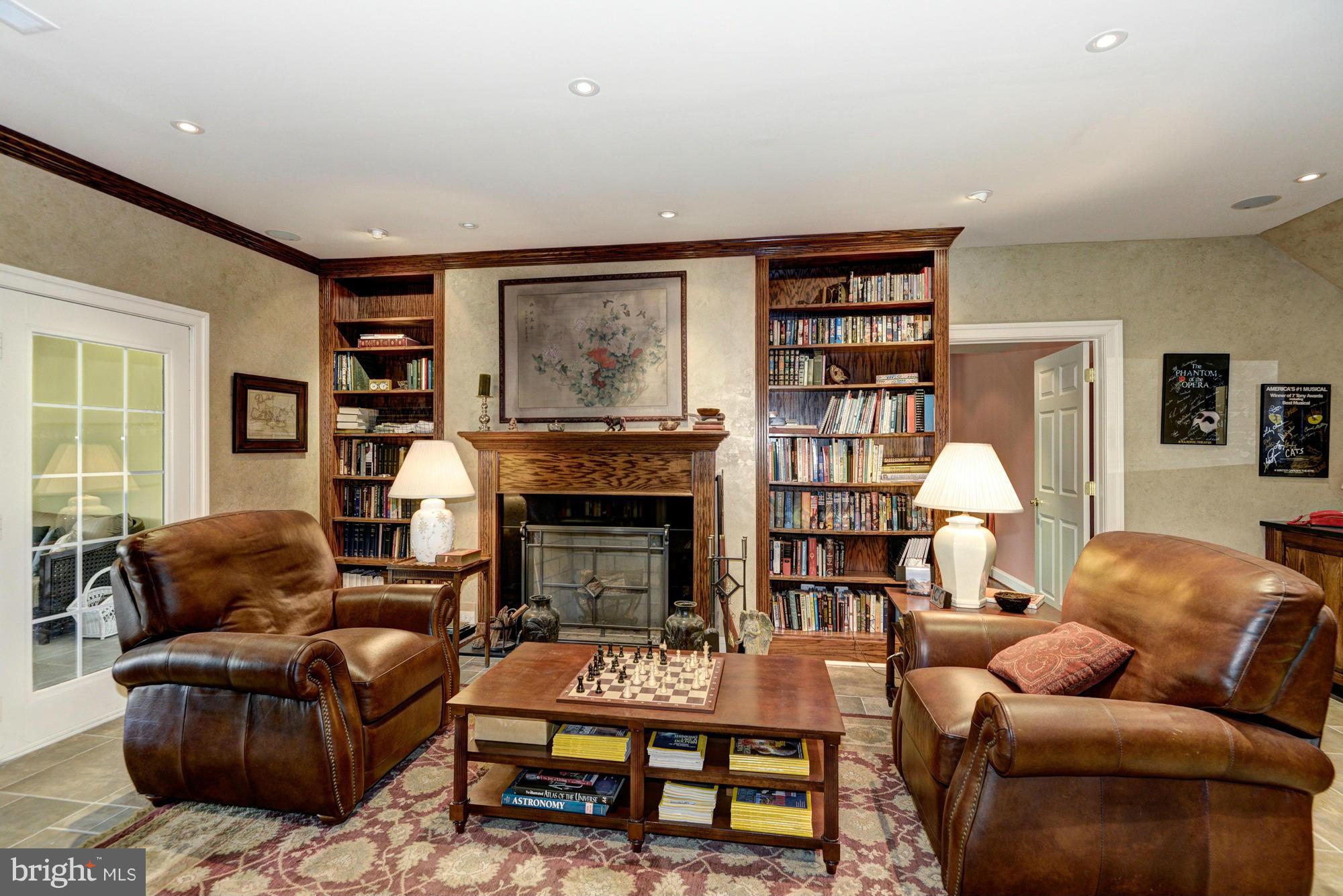20500 Westerly Road Poolesville, MD 20837 - Photo 19 of 30 a living room with furniture and a fireplace