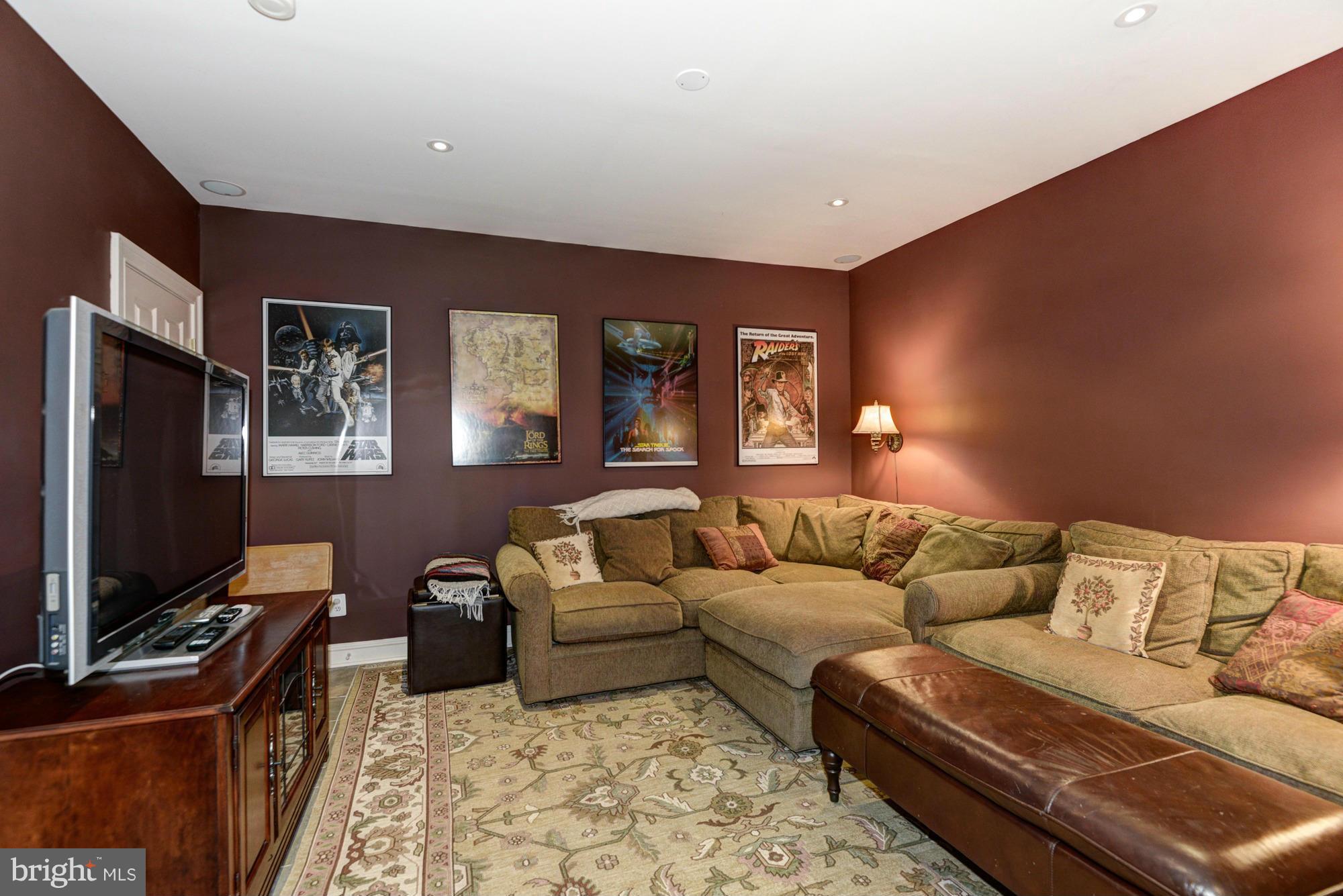 20500 Westerly Road Poolesville, MD 20837 - Photo 20 of 30 a living room with furniture and a flat screen tv