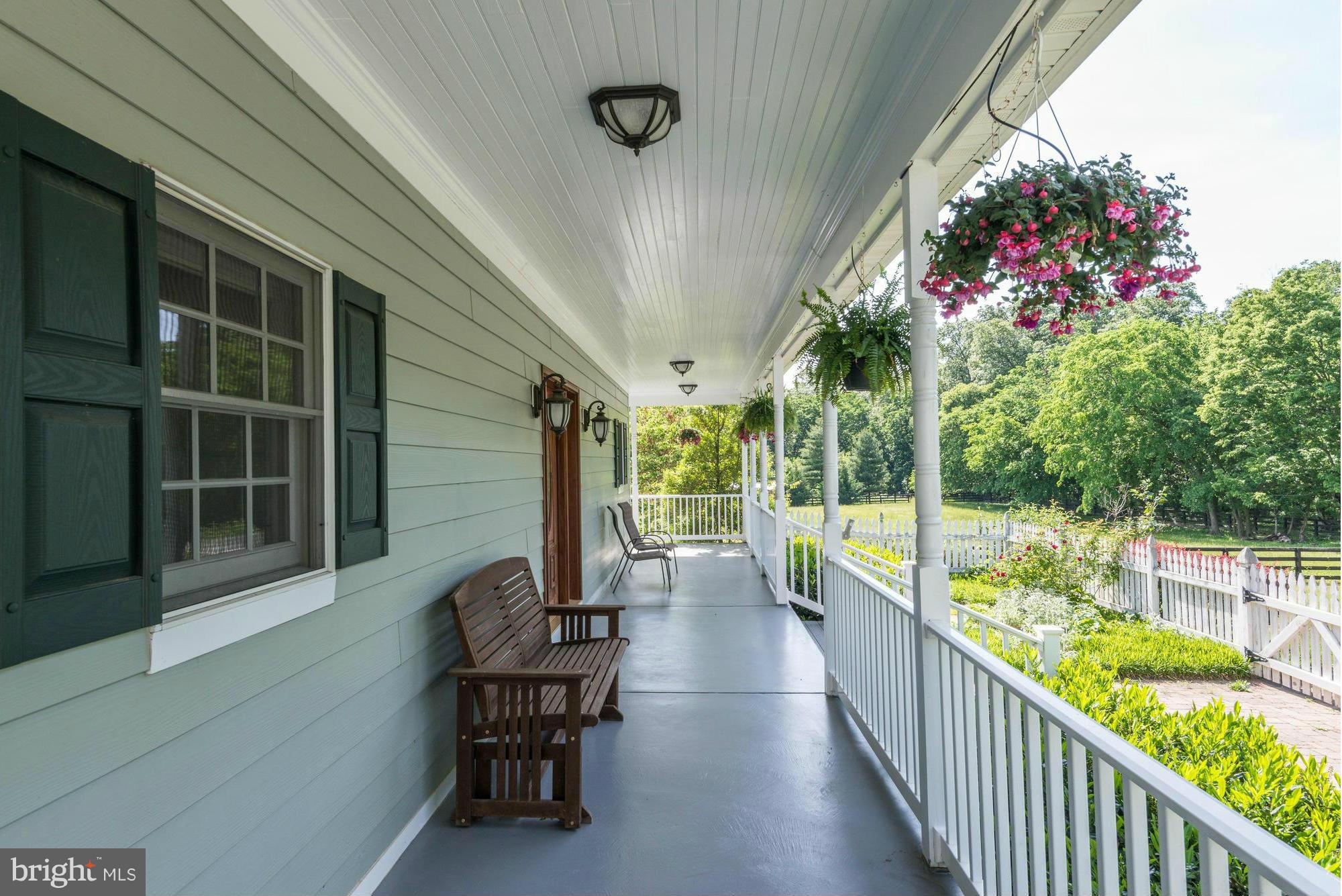 20500 Westerly Road Poolesville, MD 20837 - Photo 3 of 30 a view of a house with sitting area and garden