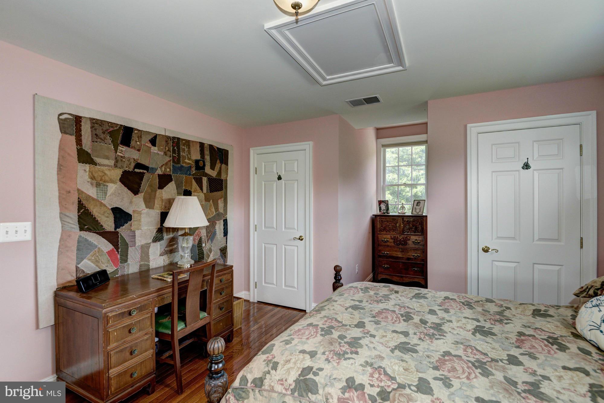 20500 Westerly Road Poolesville, MD 20837 - Photo 24 of 30 a bedroom with a bed and a window
