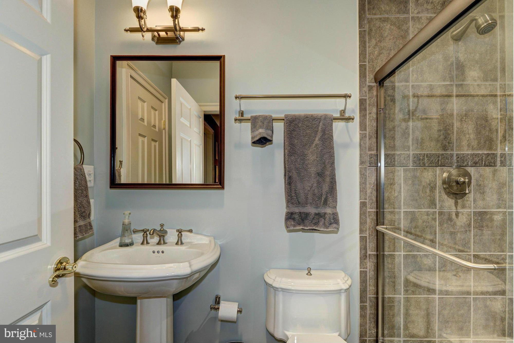 20500 Westerly Road Poolesville, MD 20837 - Photo 26 of 30 a bathroom with a sink toilet and shower