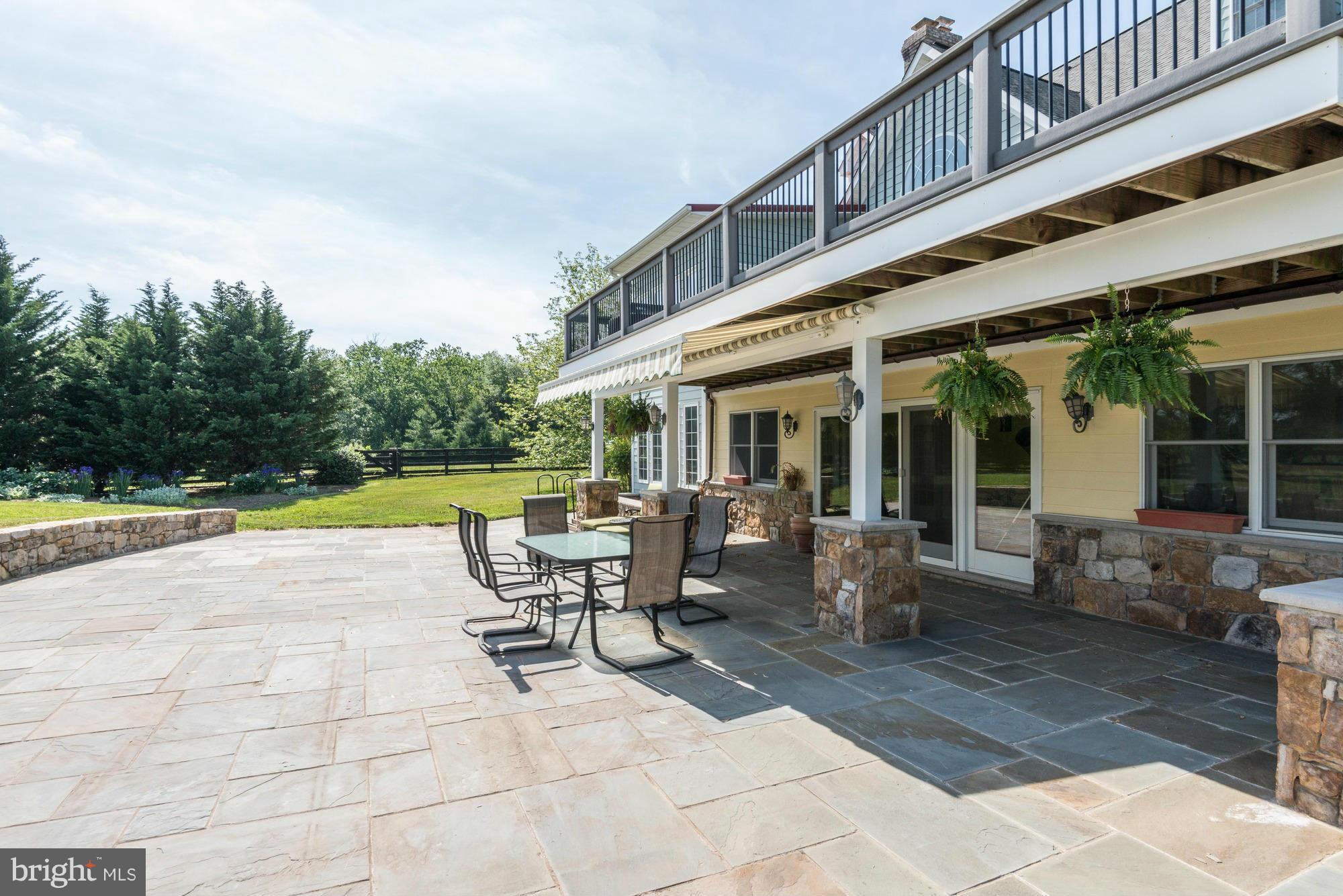 20500 Westerly Road Poolesville, MD 20837 - Photo 4 of 30 a view of a house with backyard porch and sitting area