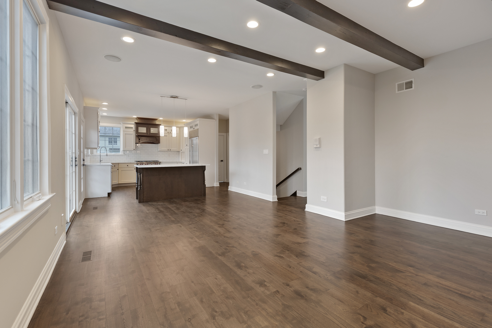 115 Washington Street Glenview, IL 60025 - Photo 11 of 40 a view of kitchen and hall with wooden floor