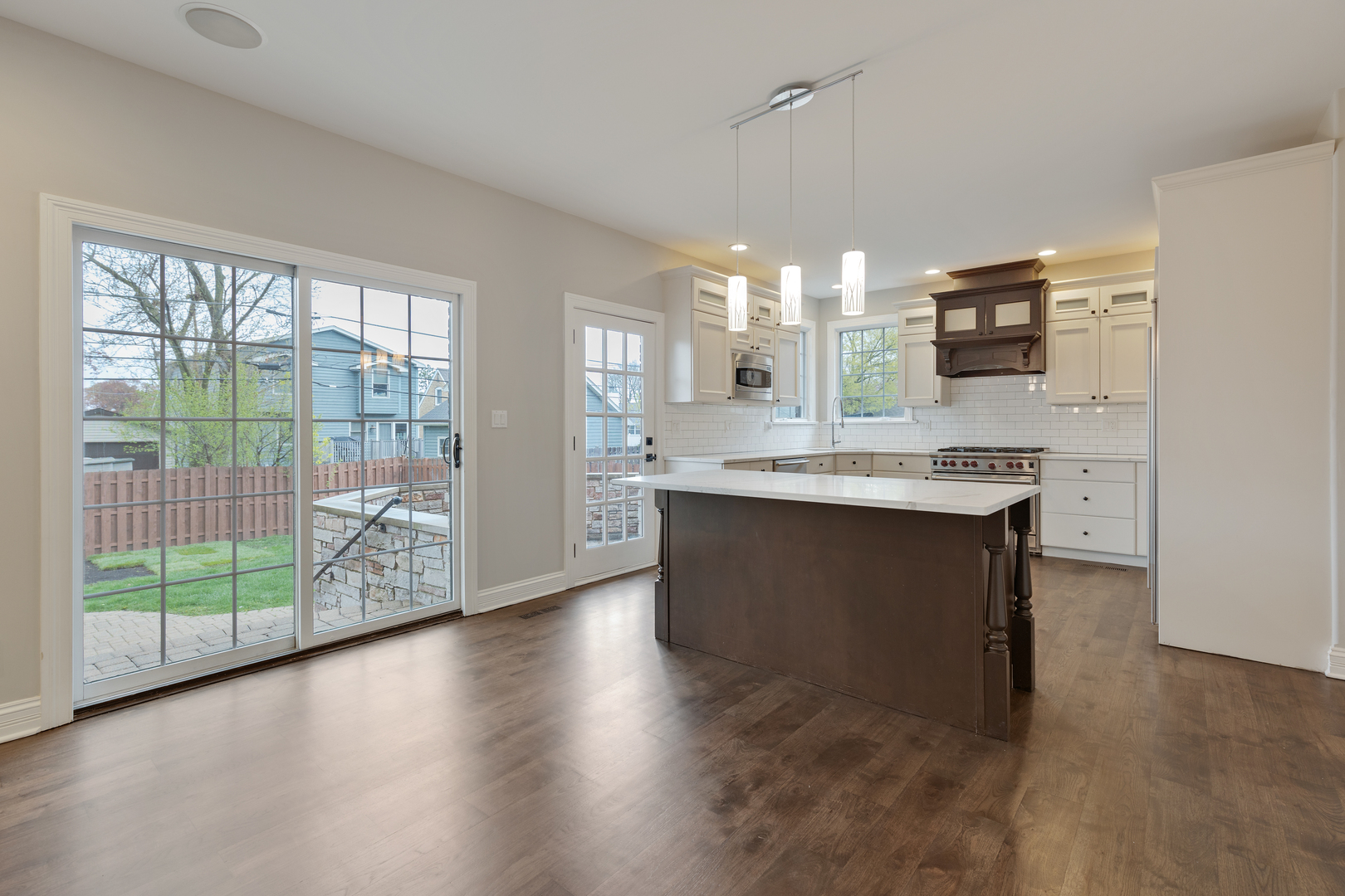 115 Washington Street Glenview, IL 60025 - Photo 12 of 40 a large kitchen with kitchen island granite countertop a large window and a sink