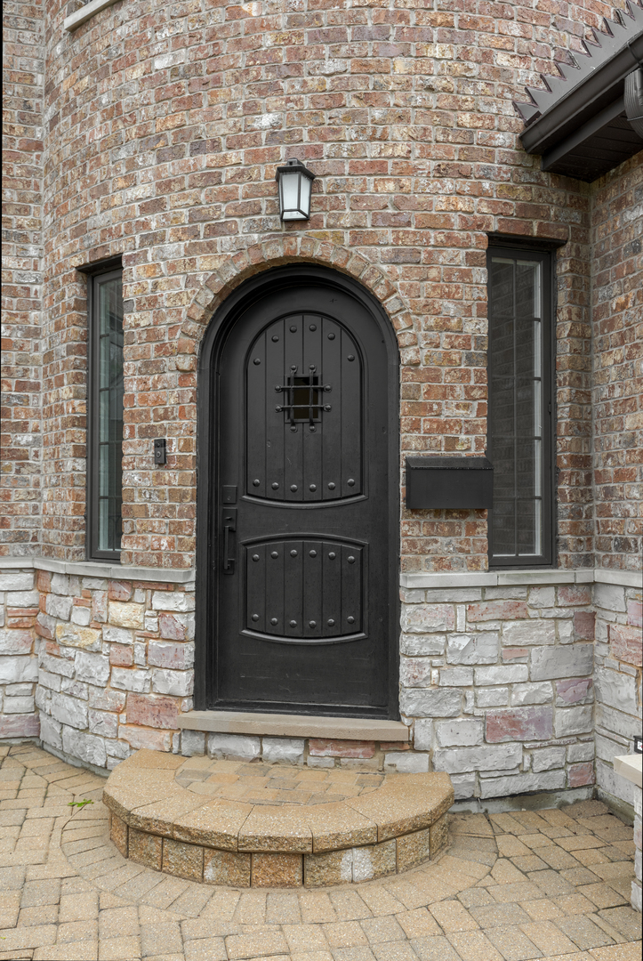 115 Washington Street Glenview, IL 60025 - Photo 2 of 40 a front view of a house with garage