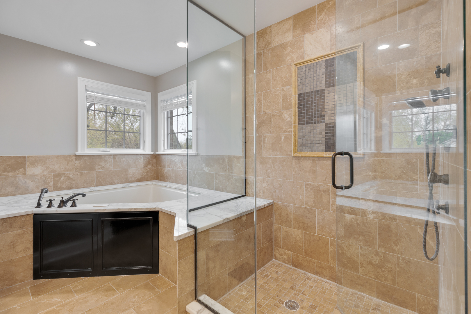 115 Washington Street Glenview, IL 60025 - Photo 21 of 40 a bathroom with a granite countertop sink a glass door shower and a mirror