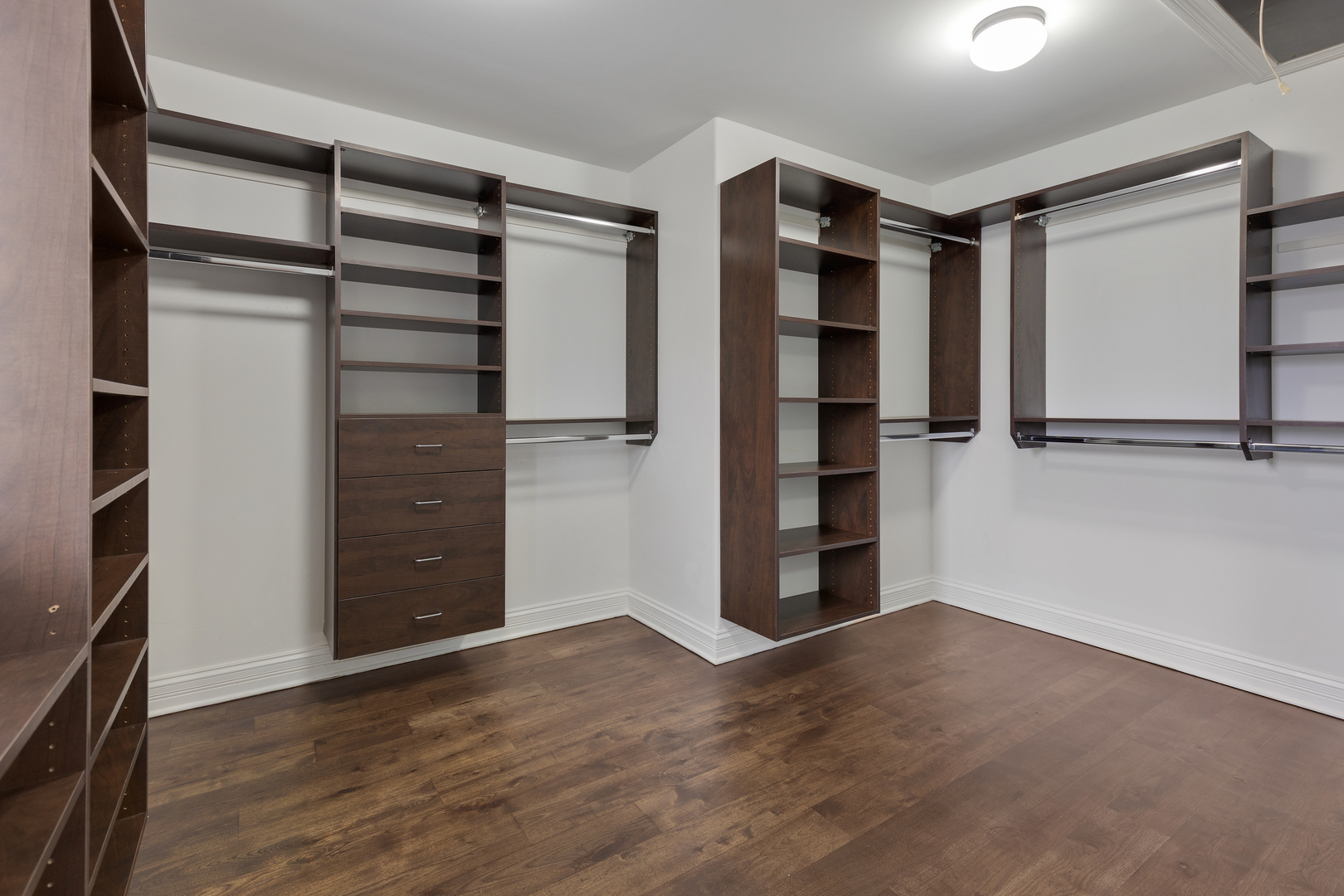 115 Washington Street Glenview, IL 60025 - Photo 22 of 40 a view of walk in closet with empty racks