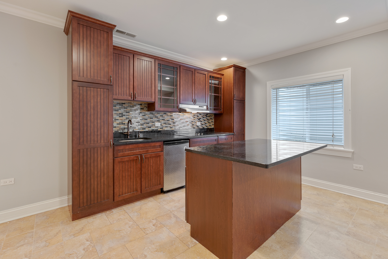 115 Washington Street Glenview, IL 60025 - Photo 32 of 40 a kitchen with stainless steel appliances granite countertop wooden cabinets and sink