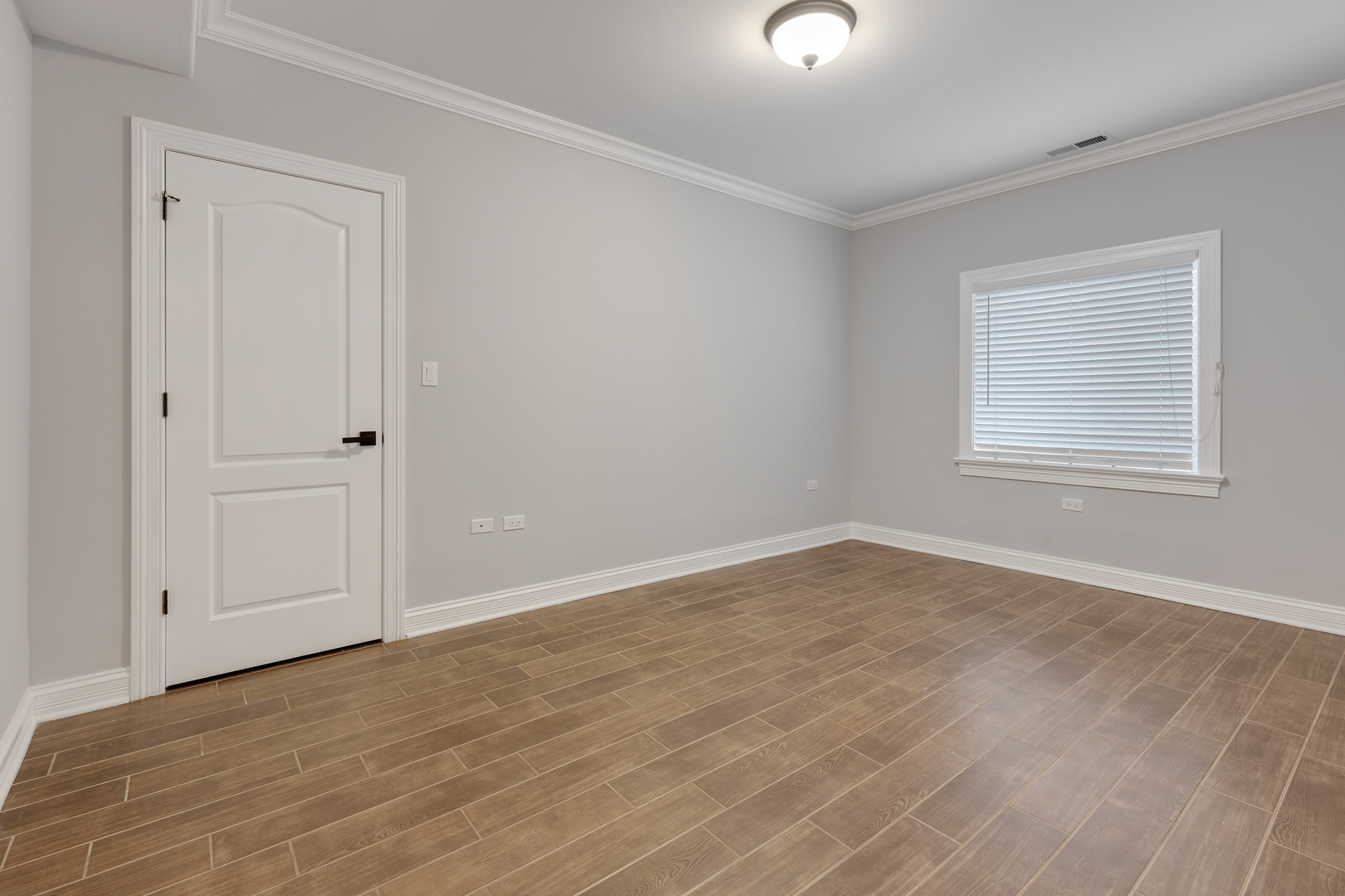 115 Washington Street Glenview, IL 60025 - Photo 35 of 40 a view of an empty room with wooden floor closet and windows