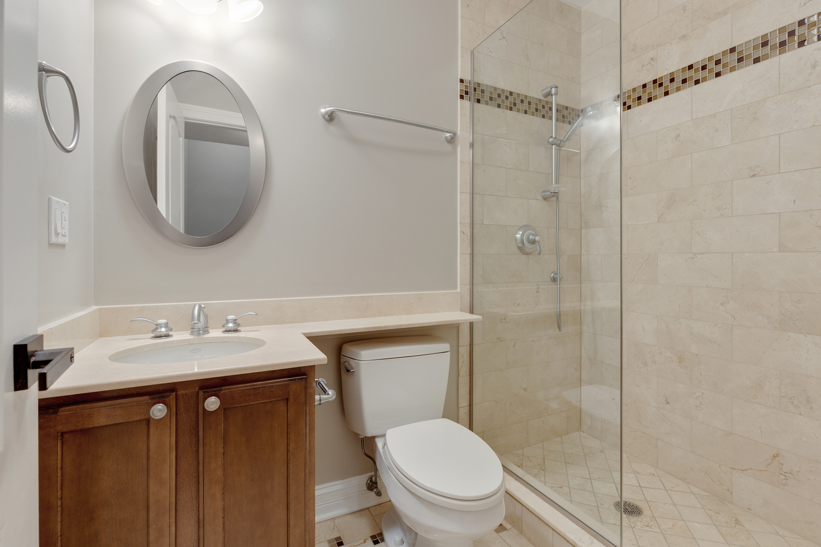 115 Washington Street Glenview, IL 60025 - Photo 36 of 40 a bathroom with a toilet sink vanity granite and shower