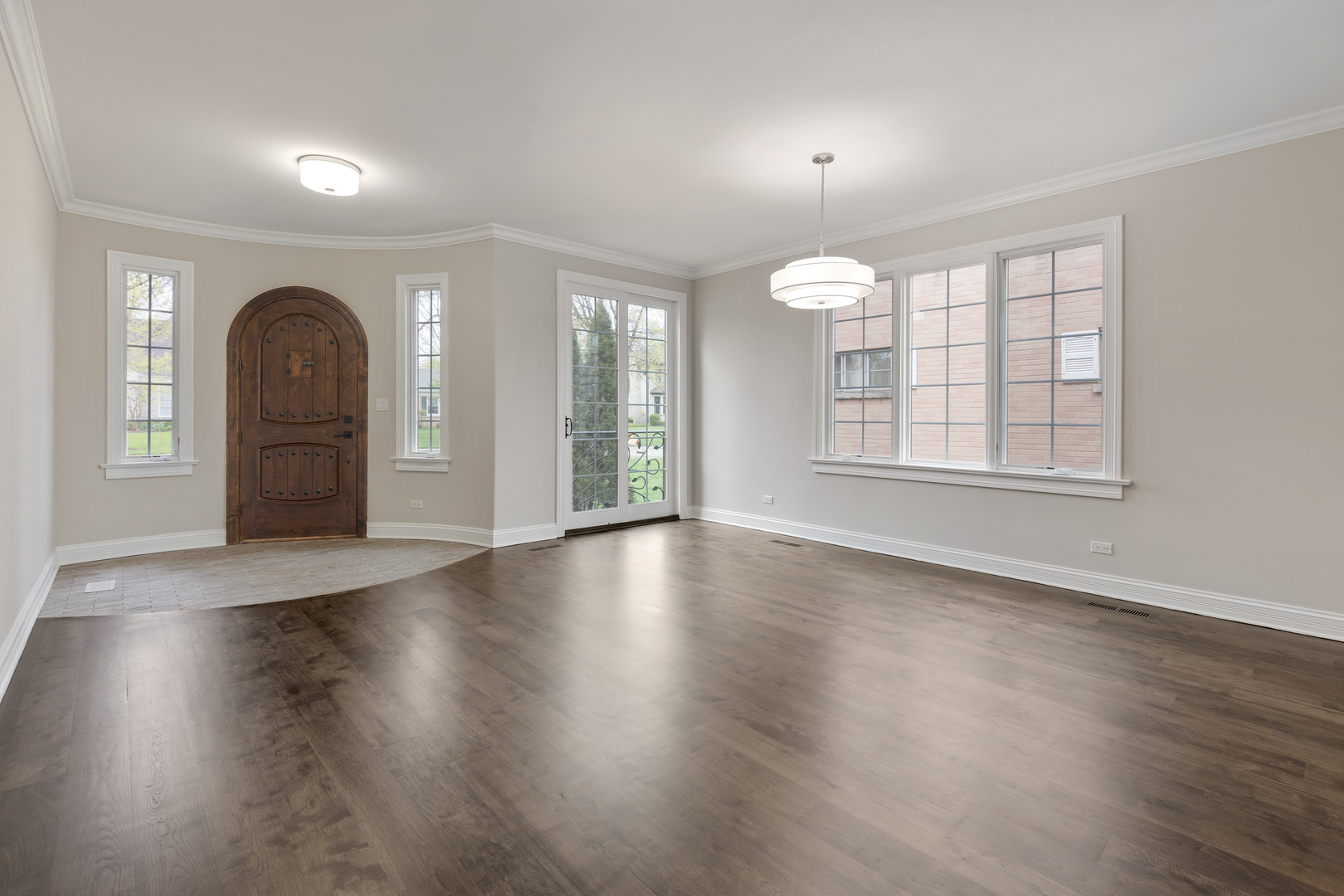 115 Washington Street Glenview, IL 60025 - Photo 4 of 40 an empty room with wooden floor and windows