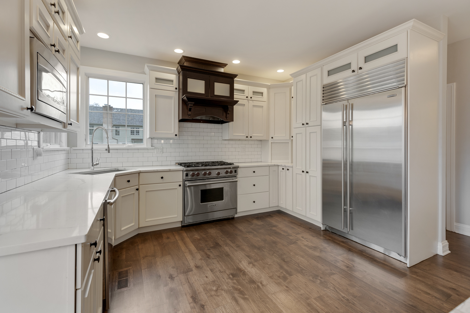 115 Washington Street Glenview, IL 60025 - Photo 10 of 40 a kitchen with stainless steel appliances a refrigerator sink and microwave