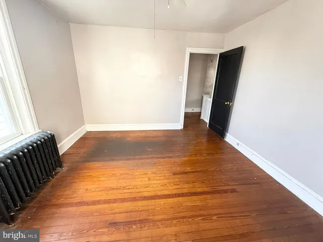 a view of a room with wooden floor and stairs