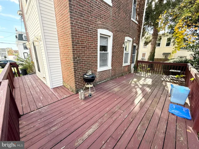 a view of balcony with wooden floor