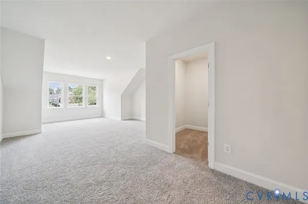 a view of room with window and ceiling fan