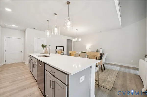 a large kitchen with a table and chairs