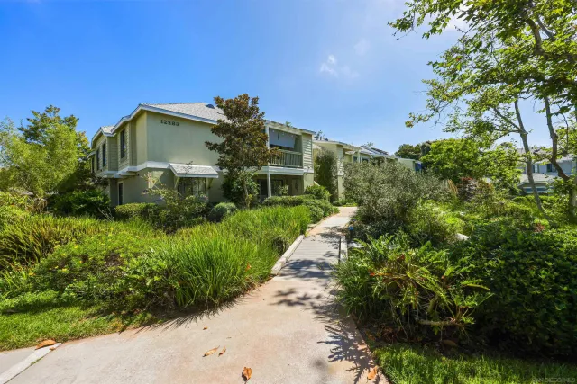 a view of a swimming pool with sitting area