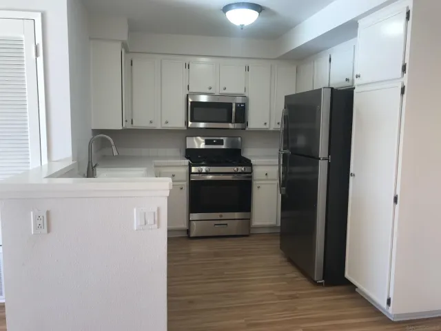 a bathroom with double vanity sinks and a mirror