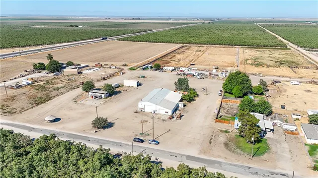an aerial view of multiple houses with yard