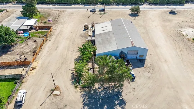a view of a house with wooden fence
