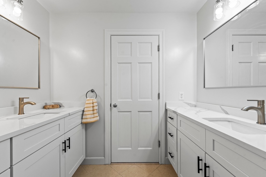 24 Battle Green Road Lexington, MA 02421 - Photo 15 of 25 a bathroom with a sink and a mirror