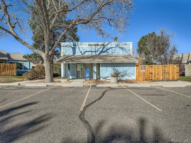 a view of a street with a building in the background