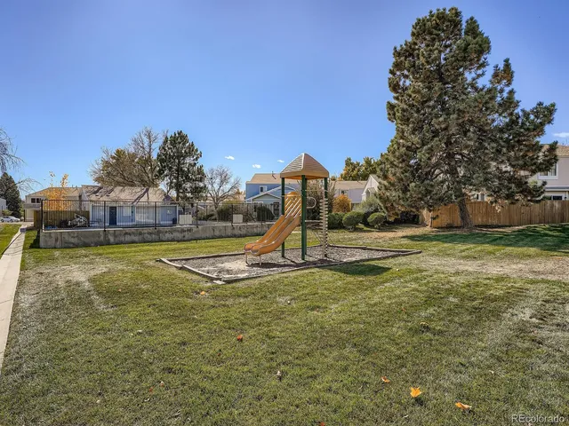 a view of a lake with houses in the back