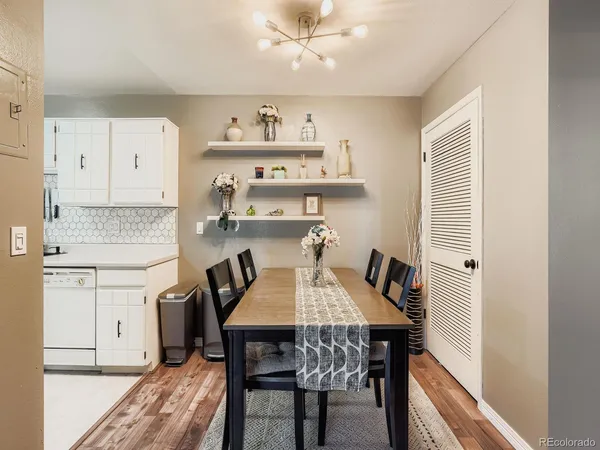 a view of a dining room with furniture and wooden floor