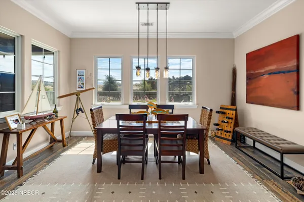a view of a dining room with furniture window and outside view