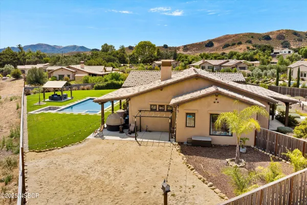 a view of a swimming pool with a yard