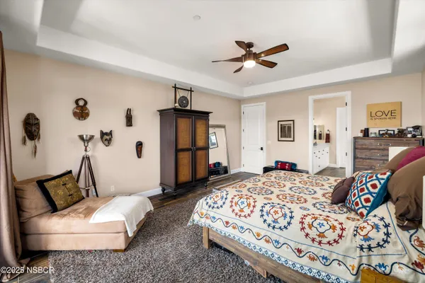 a white bath tub sitting in a bathroom next to a window