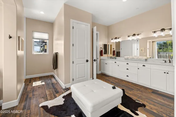 a spacious bathroom with a bathtub and next to a window