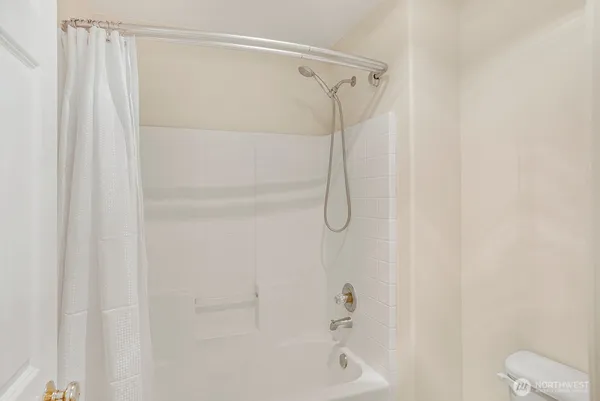 a bathroom with a shower and a shower