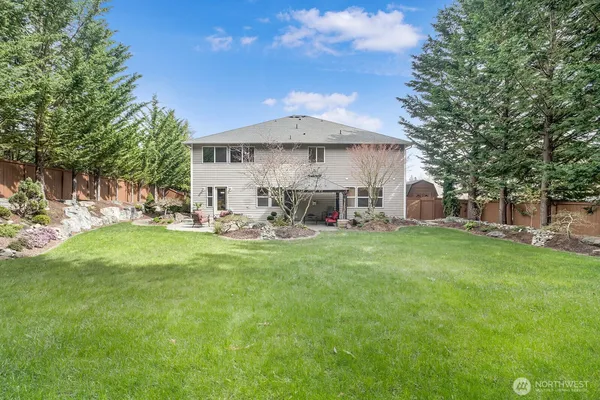 a view of a house with a back yard
