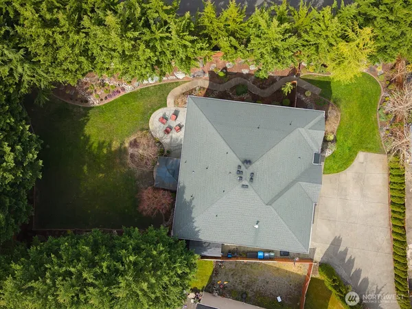 an aerial view of a house with a yard