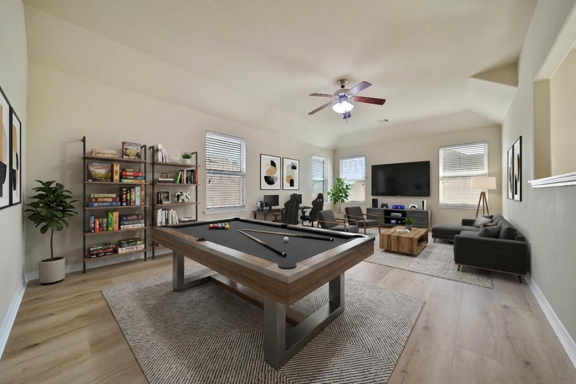 4419 Fenway Park Way Spring, TX 77389 - Photo 20 of 36 a living room with furniture a flat screen tv and a table