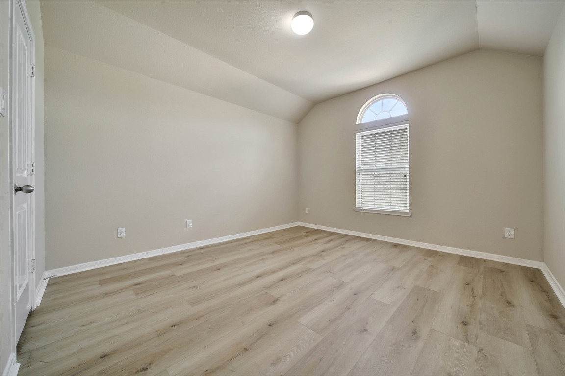 4419 Fenway Park Way Spring, TX 77389 - Photo 25 of 36 an empty room with wooden floor and windows