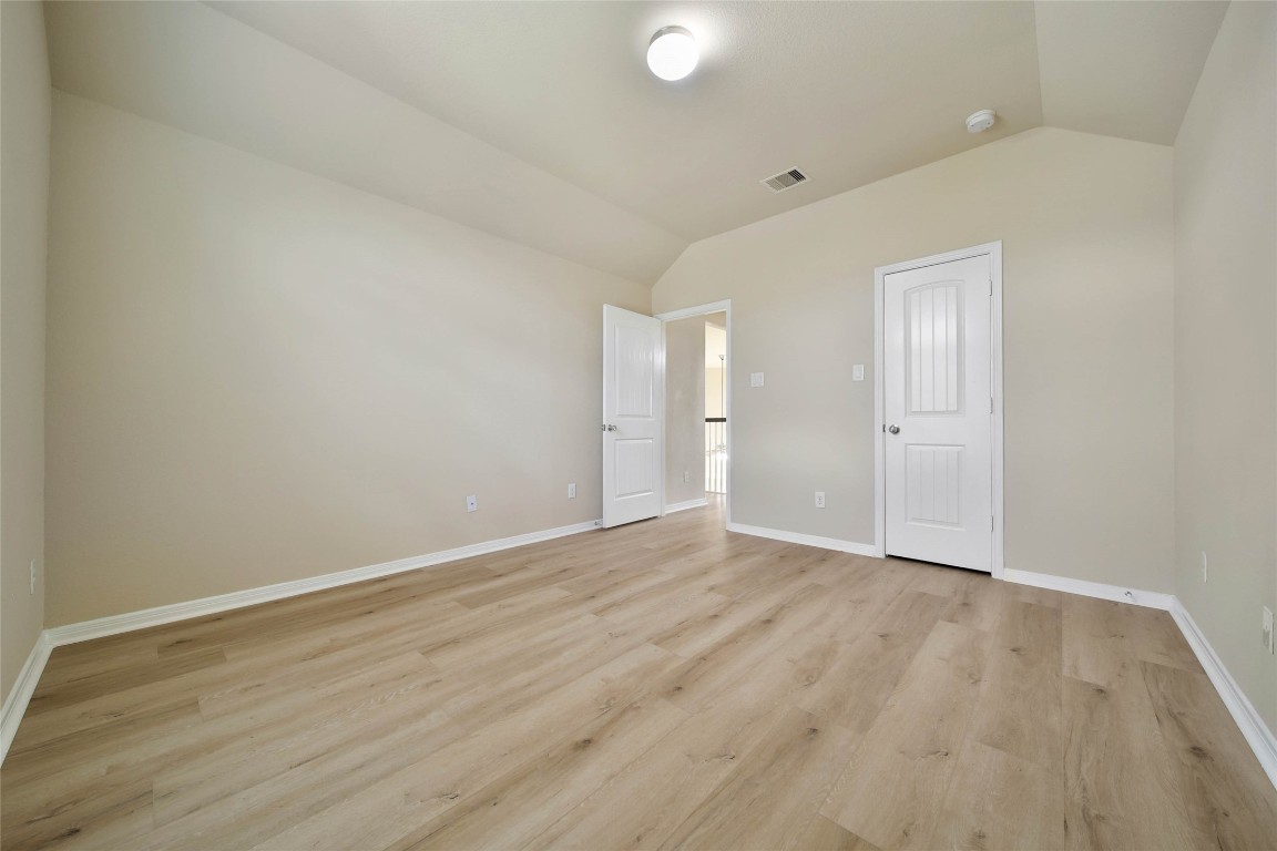 4419 Fenway Park Way Spring, TX 77389 - Photo 26 of 36 a view of an empty room with wooden floor and closet