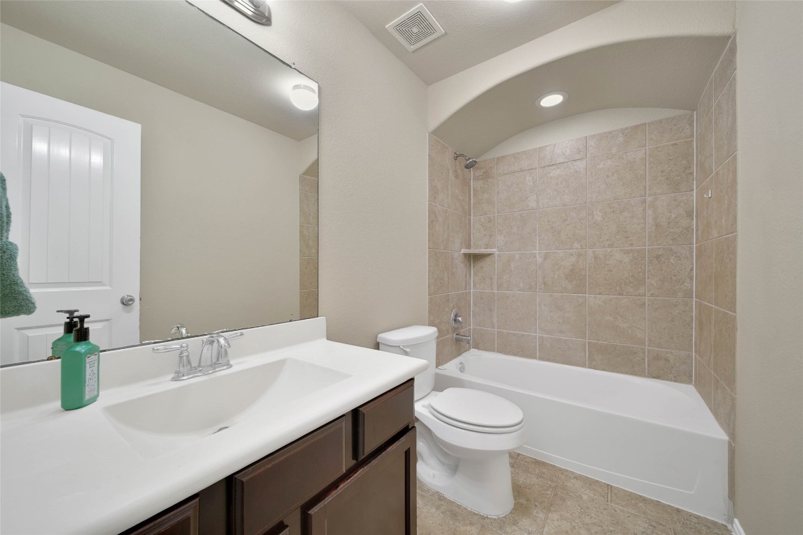 4419 Fenway Park Way Spring, TX 77389 - Photo 30 of 36 a bathroom with a sink a toilet and shower