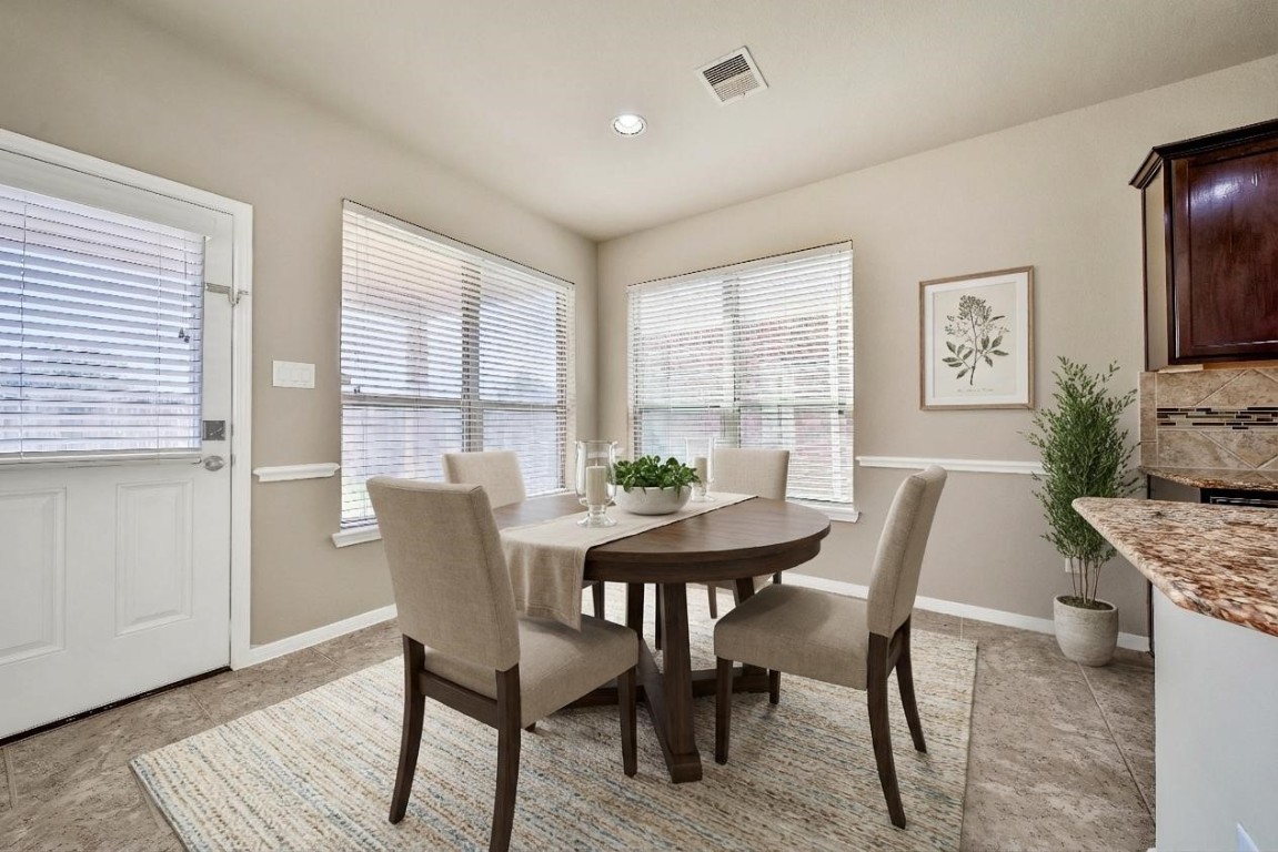 4419 Fenway Park Way Spring, TX 77389 - Photo 9 of 36 a view of a dining room with furniture and wooden floor