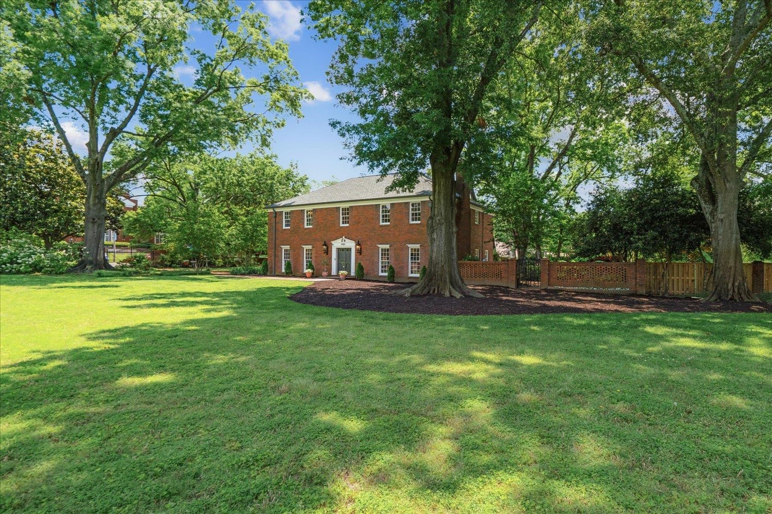 4585 Walnut Grove Road Memphis, TN 38117 - Photo 1 of 36 a view of a house with backyard and a tree