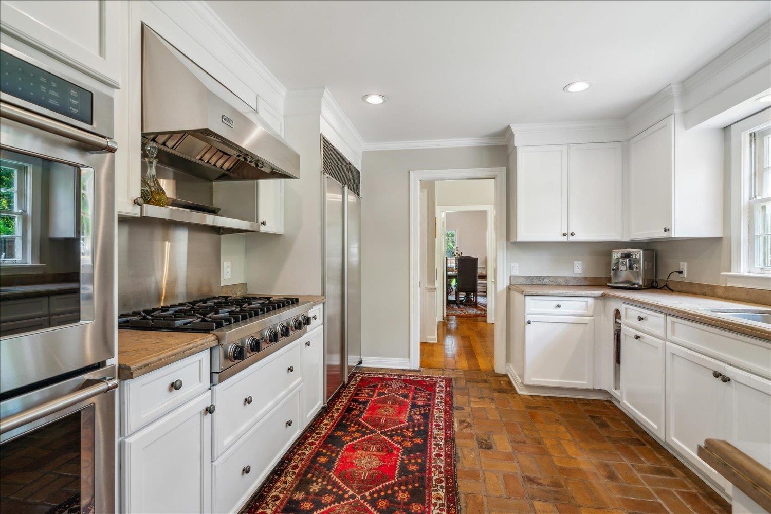 4585 Walnut Grove Road Memphis, TN 38117 - Photo 15 of 36 a kitchen with stainless steel appliances granite countertop a stove and a refrigerator