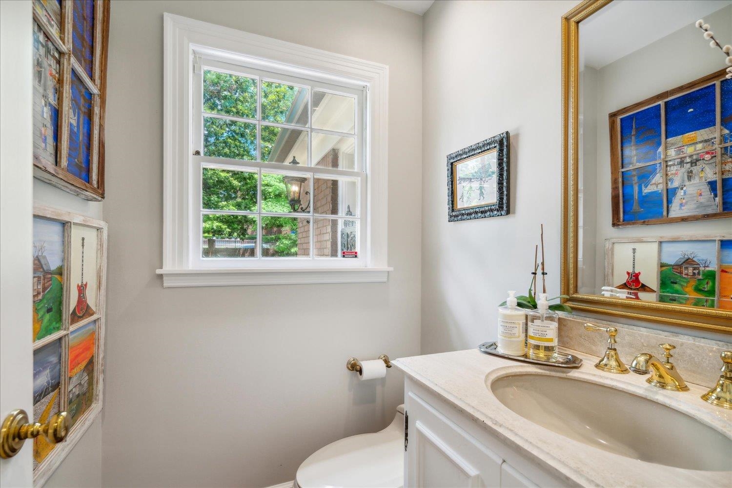 4585 Walnut Grove Road Memphis, TN 38117 - Photo 18 of 36 a bathroom with a sink toilet and a window