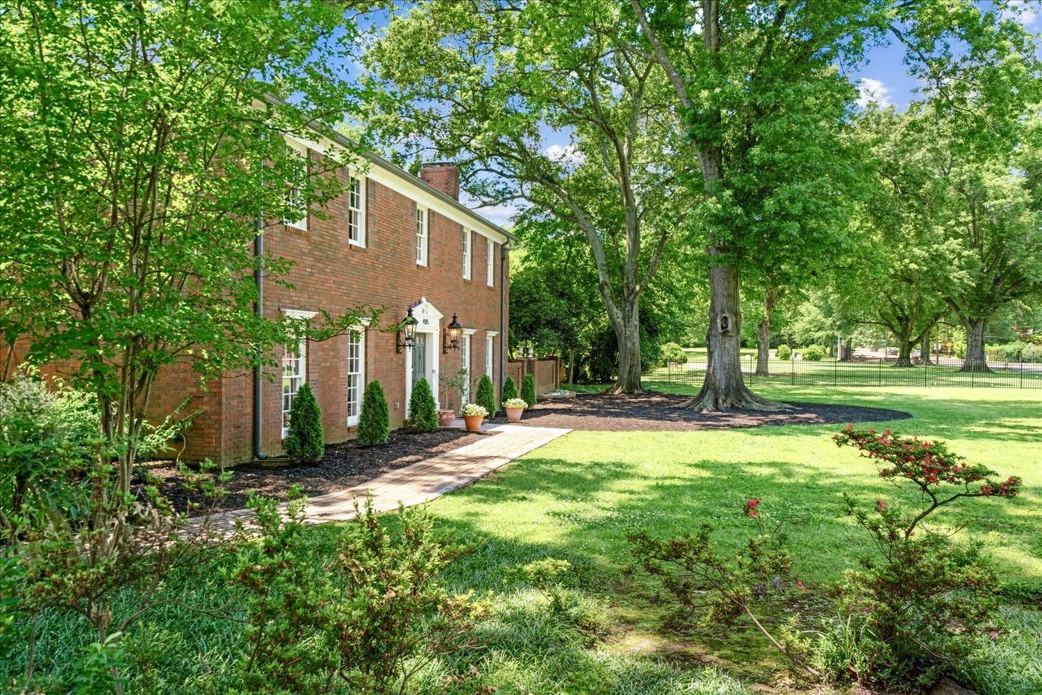 4585 Walnut Grove Road Memphis, TN 38117 - Photo 2 of 36 a front view of a house with a yard