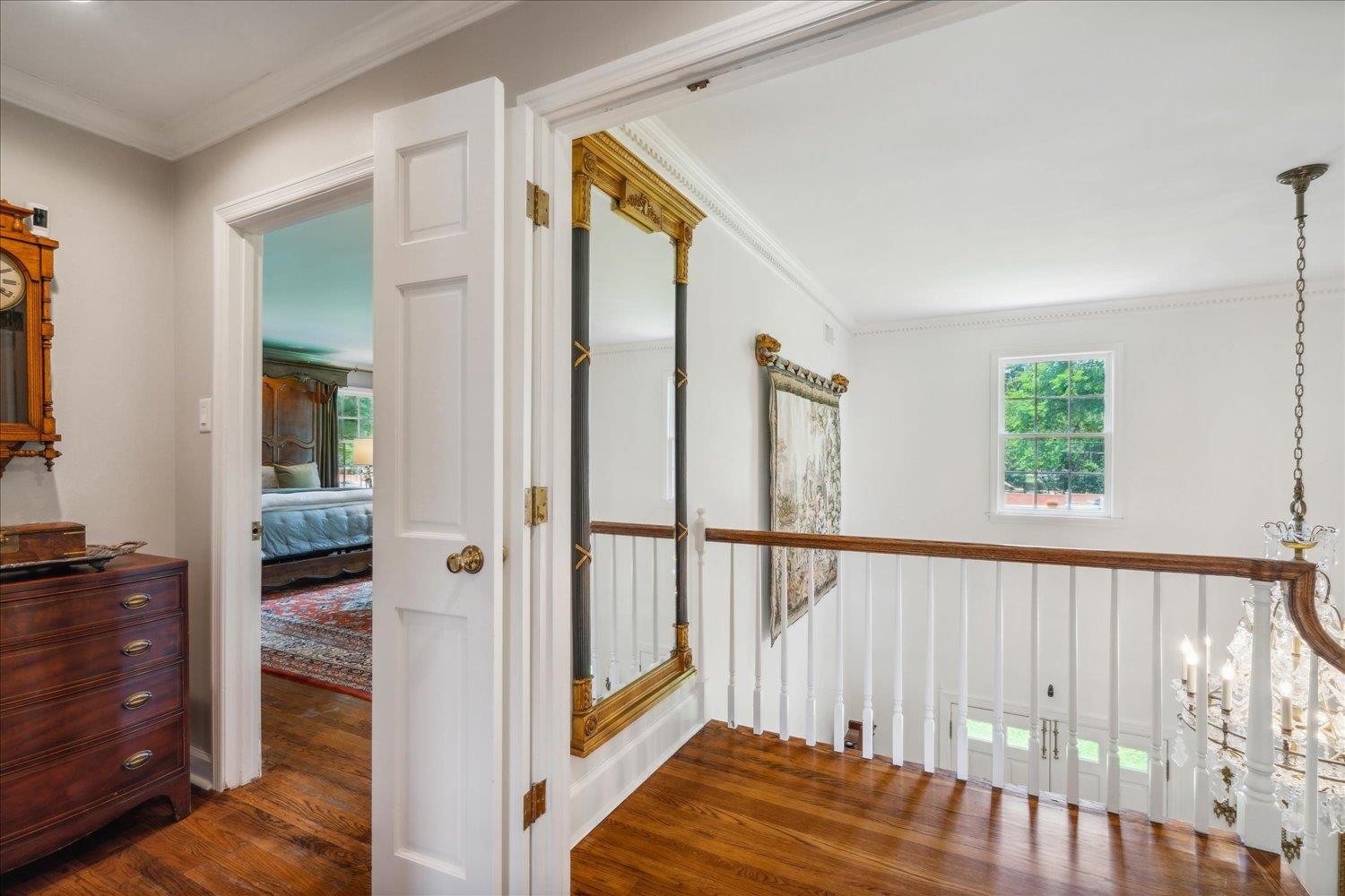 4585 Walnut Grove Road Memphis, TN 38117 - Photo 21 of 36 a view of a hallway with wooden floor and staircase
