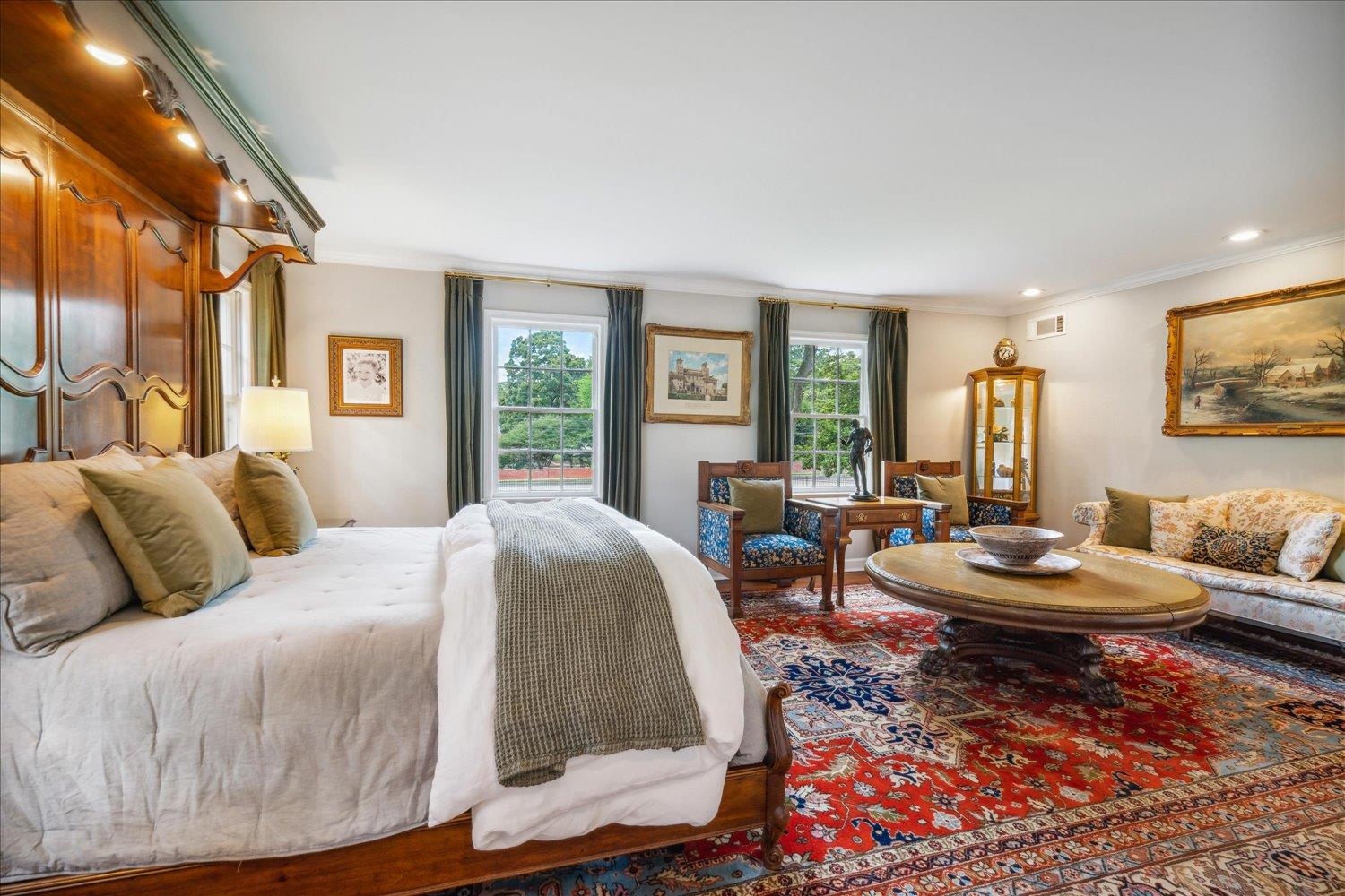 4585 Walnut Grove Road Memphis, TN 38117 - Photo 23 of 36 a bedroom with a bed a couch and large windows