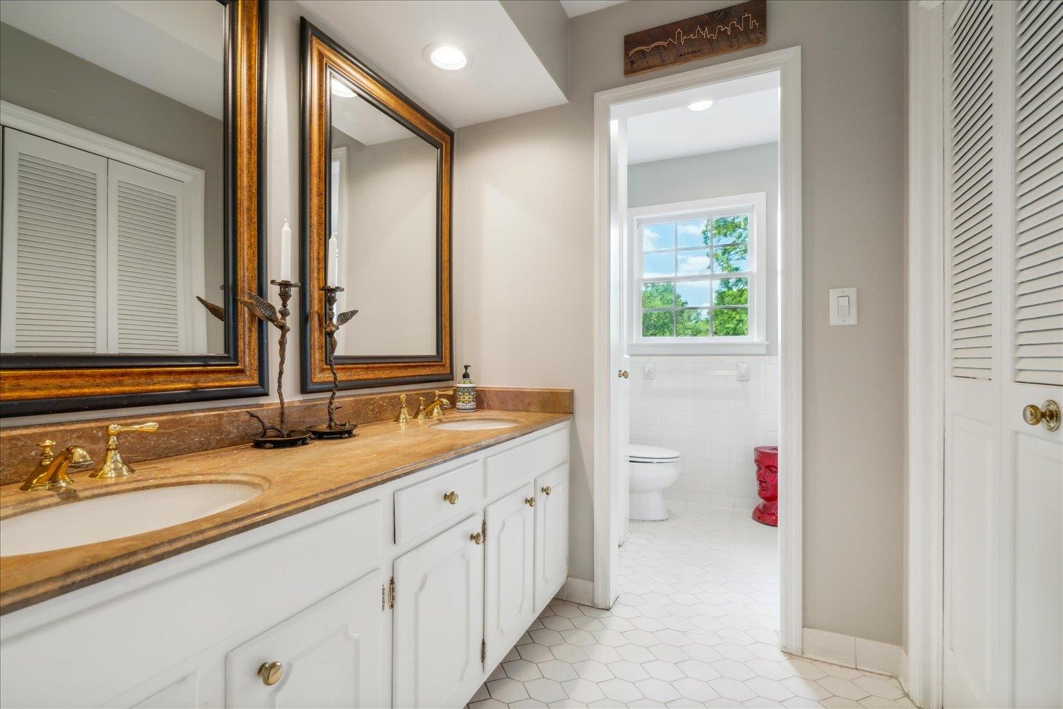 4585 Walnut Grove Road Memphis, TN 38117 - Photo 27 of 36 a bathroom with a granite countertop sink mirror and a bathtub
